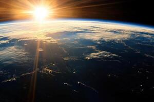 Earthrise with sun rays shining through the clouds. photo