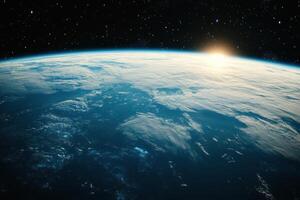 Earthrise over a dark blue ocean with the sun peeking over the horizon. photo
