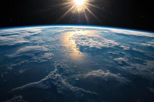 Earthrise with the sun shining over the planet. photo