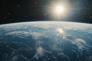 Earthrise with the sun shining over the horizon, viewed from space. photo