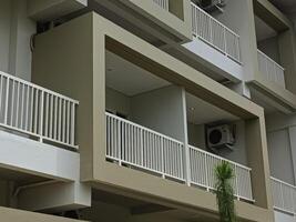 Modern Apartment Balcony with Simple Design and White Railings photo