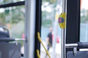 Closeup of Bus bell switch for stop inside the public bus photo