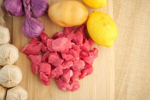 Using Fresh Ingredients to Create Delicious and Wholesome Dishes Meat, Vegetables, and Citrus photo