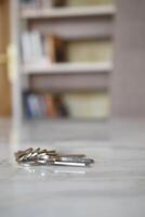 house keys on the ring on table in a room. To forget keys at home concept , photo