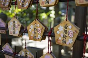 A votive tablet at Nanasha shrine in Tokyo front blur photo