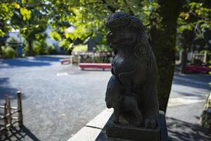 A statue of guardian dog KOMAINU at Nanasha shrine in Tokyo photo