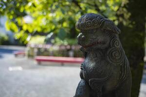 A statue of guardian dog KOMAINU at Nanasha shrine in Tokyo photo