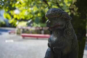 A statue of guardian dog KOMAINU at Nanasha shrine in Tokyo photo