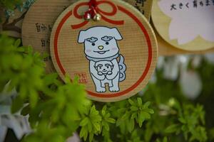 A votive tablet at Nanasha shrine in Tokyo close up photo