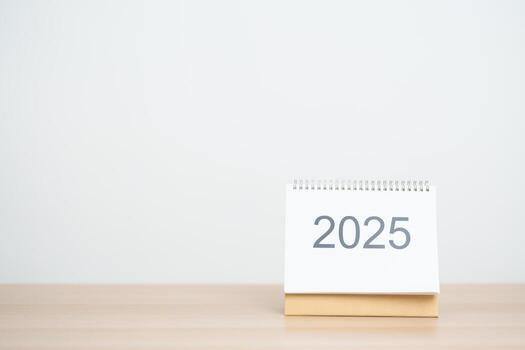 2025 Year Calendar on table in office background. countdown, Happy New Year, Resolution, Year End and New Start and Goals Plan Action Concept photo