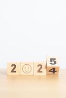 Happy New Year 2025 with Sad face block. Satisfaction, feedback, Review, mental health, eco sustainable and bad year concept photo