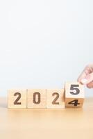 2024 change to 2025 year block on table. goal, Resolution, strategy, plan, start, budget, mission, action, motivation and New Year concepts photo