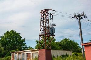 Medium voltage power tower and transformer substation. Used by small consumers and small industry. photo