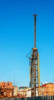 Hydraulic drilling rig. Installation of bored piles with a casing string. Foundations and grounds. Drilling in the ground. technology. Machine for drilling holes in the ground. photo
