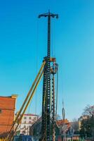 Hydraulic drilling rig. Installation of bored piles with a casing string. Foundations and grounds. Drilling in the ground. technology. Machine for drilling holes in the ground. photo