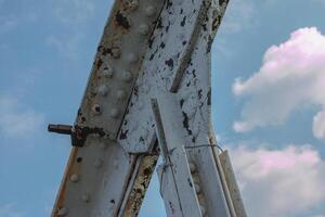 Structural elements of the old pedestrian bridge built in the USSR across the Dnieper River. photo