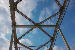 Structural elements of the old pedestrian bridge built in the USSR across the Dnieper River. photo