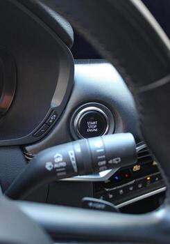Function Buttons And Electronic Controls On Car Dashboard Under Steering Wheel photo