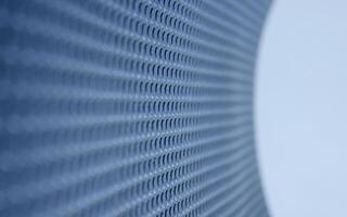 Rolled sheet of shockproof material with extruded round texture. Abstract 3d background of blue textured surface photo