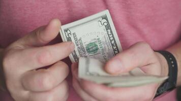 A closeup showing hands counting dollar bills, highlighting the importance of cash management in transactions video