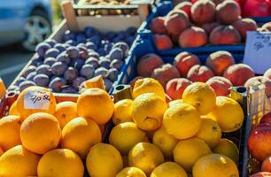 Fresh lemons are stacked on supermarket shelf and ready for purchase. Each lemon is ripe and full of citrus notes. Ideal for demonstrating availability and quality of fresh lemons in grocery stores. photo