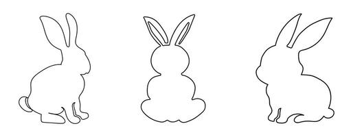 Set of black outlines of rabbits isolated on a white background. vector