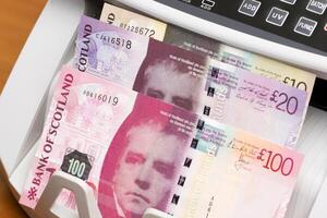 Scottish pound in the counting machine photo