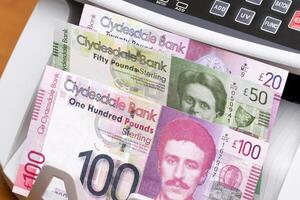 Scottish pound in the counting machine photo