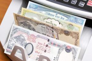 Nepalese rupee in the counting machine photo