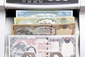 Nepalese rupee in the counting machine photo