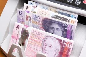 Scottish pound in the counting machine photo