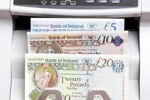 Irish pound in the counting machine photo