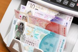 Scottish pound in the counting machine photo