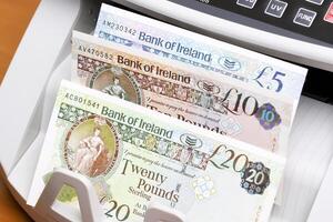 Irish pound in the counting machine photo