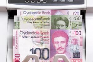 Scottish pound in the counting machine photo