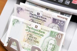 Scottish pound in the counting machine photo