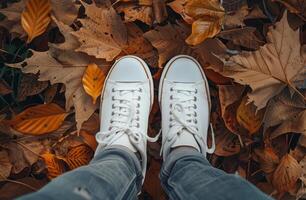 Person Standing on Top of Pile of Leaves photo