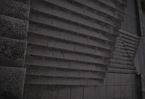 Staircase pattern with concrete steps provide a striking and textured background that is perfect for various design projects, presentations and artistic creations a perfect background. photo
