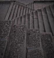 Staircase pattern with concrete steps provide a striking and textured background that is perfect for various design projects, presentations and artistic creations a perfect background. photo