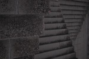 Staircase pattern with concrete steps provide a striking and textured background that is perfect for various design projects, presentations and artistic creations a perfect background. photo