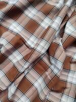 Layered fabric plaid tartan, textile fabric texture. Custom check seamless pattern background photo