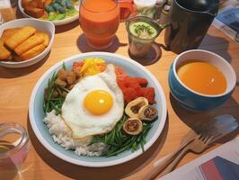 Appetizing breakfast with fried eggs, vegetables, toast and juice photo