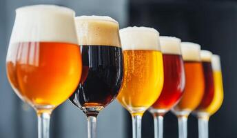 Assorted craft beers in pints displayed against a sleek black background for a vibrant and enticing presentation photo