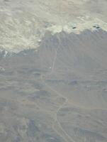 Airplane view. Mojave Desert. Small towns, roads and fields. Scenic view from above on the ground photo