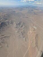 Airplane view. Mojave Desert. Small towns, roads and fields. Scenic view from above on the ground photo