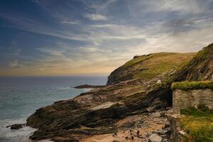 Scenic Coastal View with Rocky Cliffs and Beach in Tintagel, Cornwall, UK photo