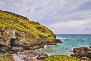 Serene Coastal Landscape with Rugged Cliffs in Tintagel, Cornwall, UK photo