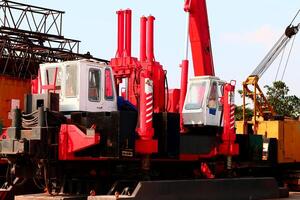 Concrete piling machine Hydraulic Static Pile Driver HSPD at construction site photo