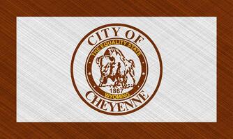 Flag of the city of Cheyenne, Wyoming, USA, on a background of fabric texture. Conceptual collage photo