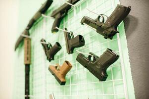 A lot of different weapons for shooting in the dash.Air guns for shooting training. photo